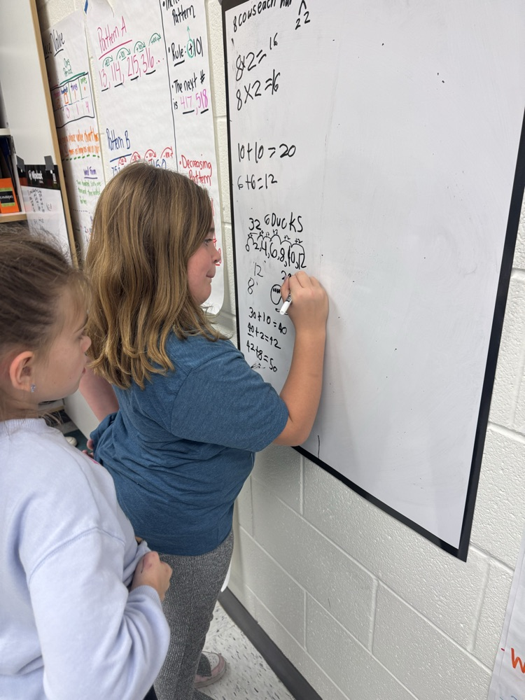 students working together on math problem 