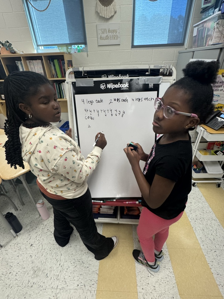students working together on math problem 
