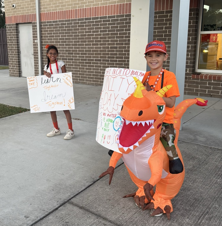students holding posters in Orange 