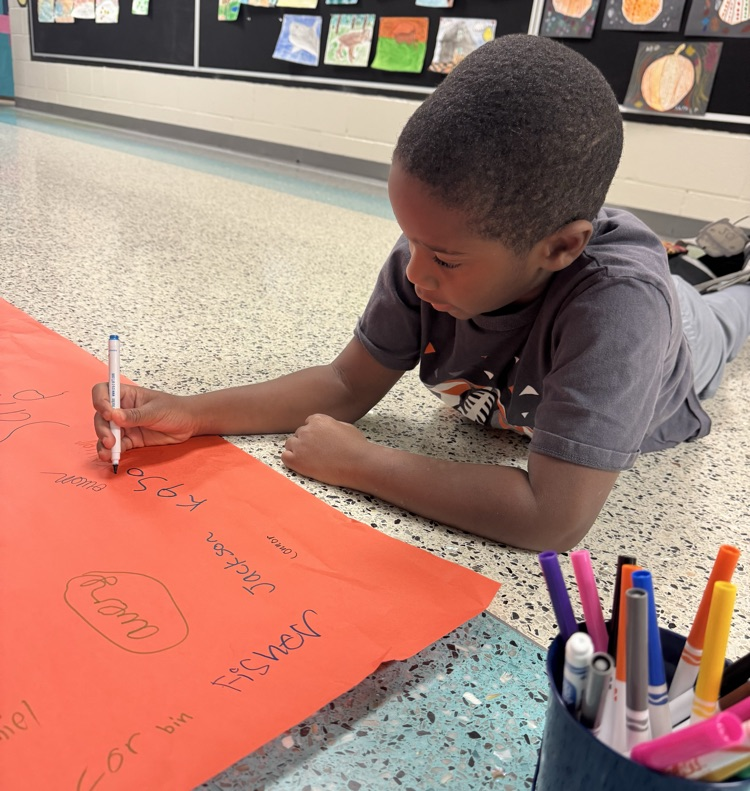 students signing posted 