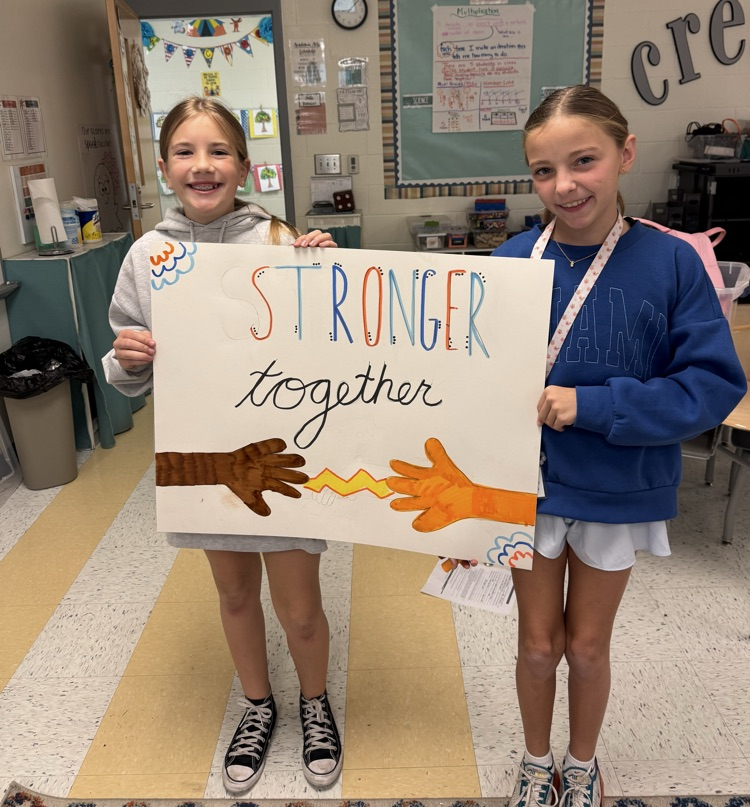 students holding poster 