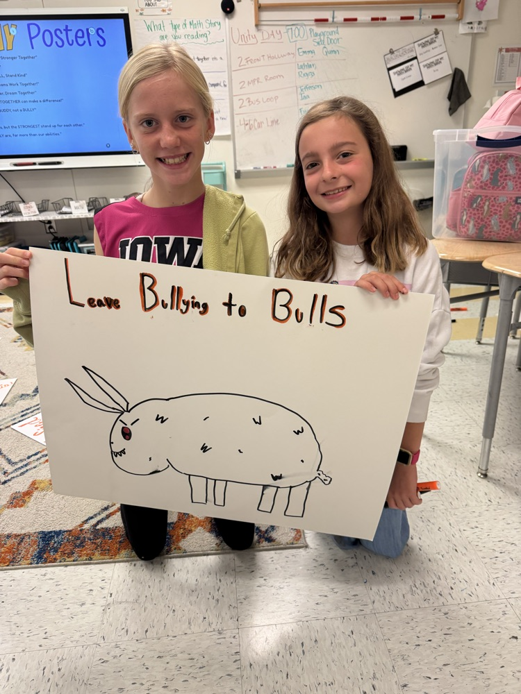 students holding poster 