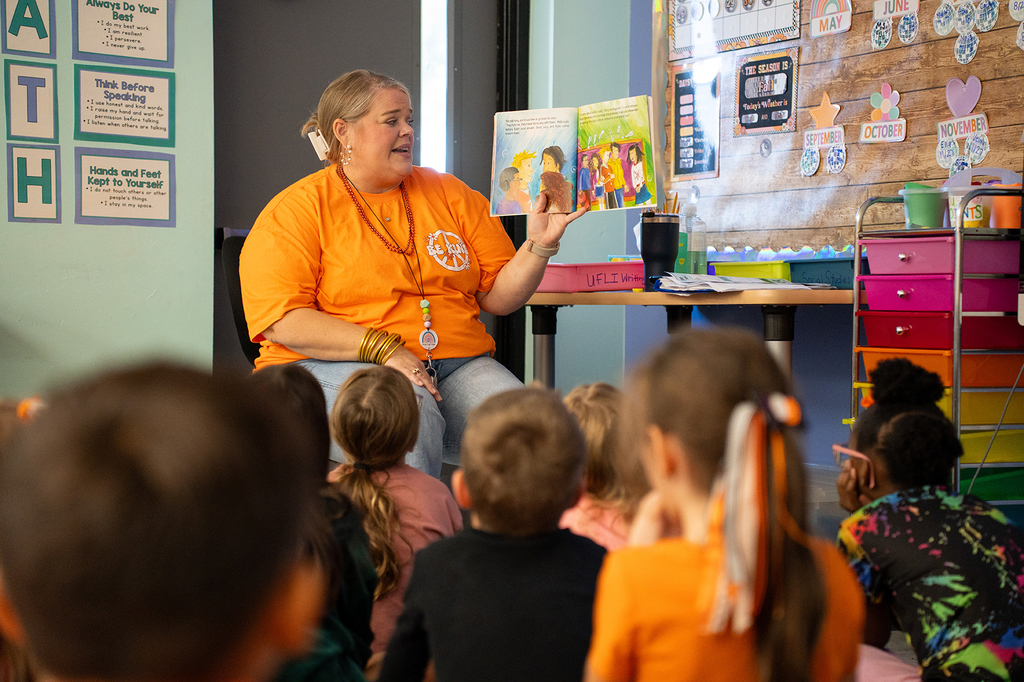 teacher reading anti-bullying book