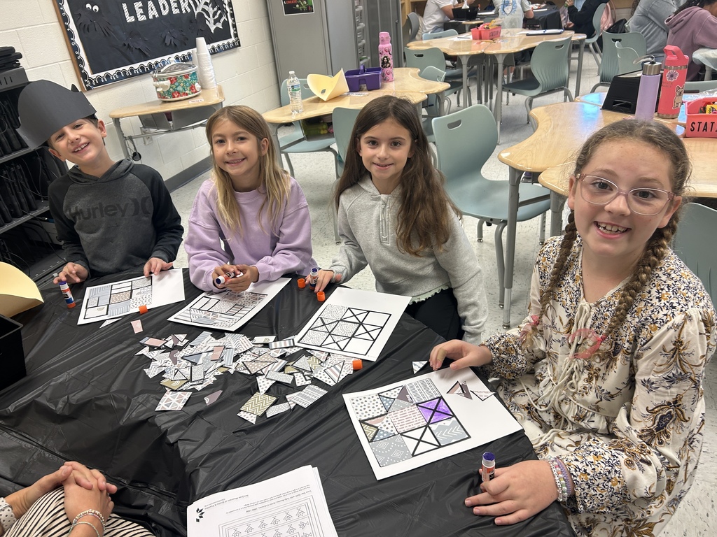 Students created patterns on their quilt squares.