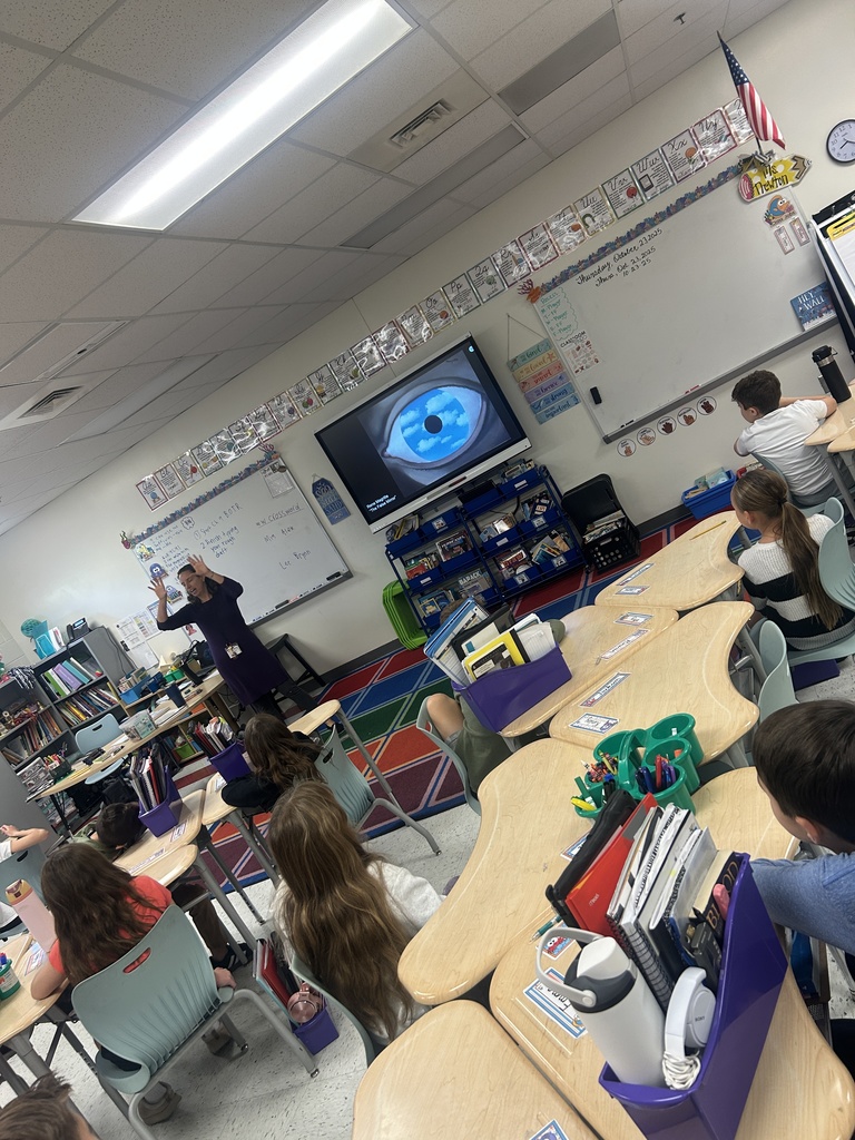 Students examined the work of Rene Magritte.