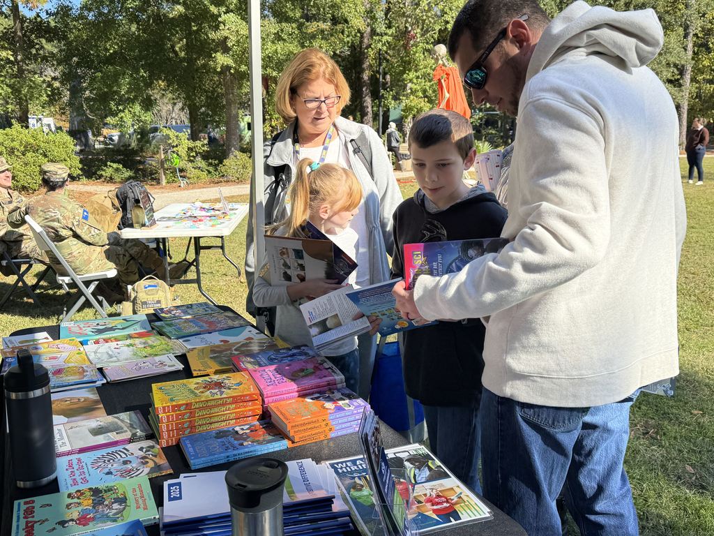 students looking at books