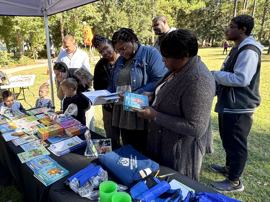 students and parents looking at books