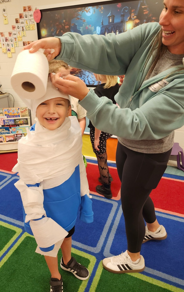kid getting wrapped in toilet paper 