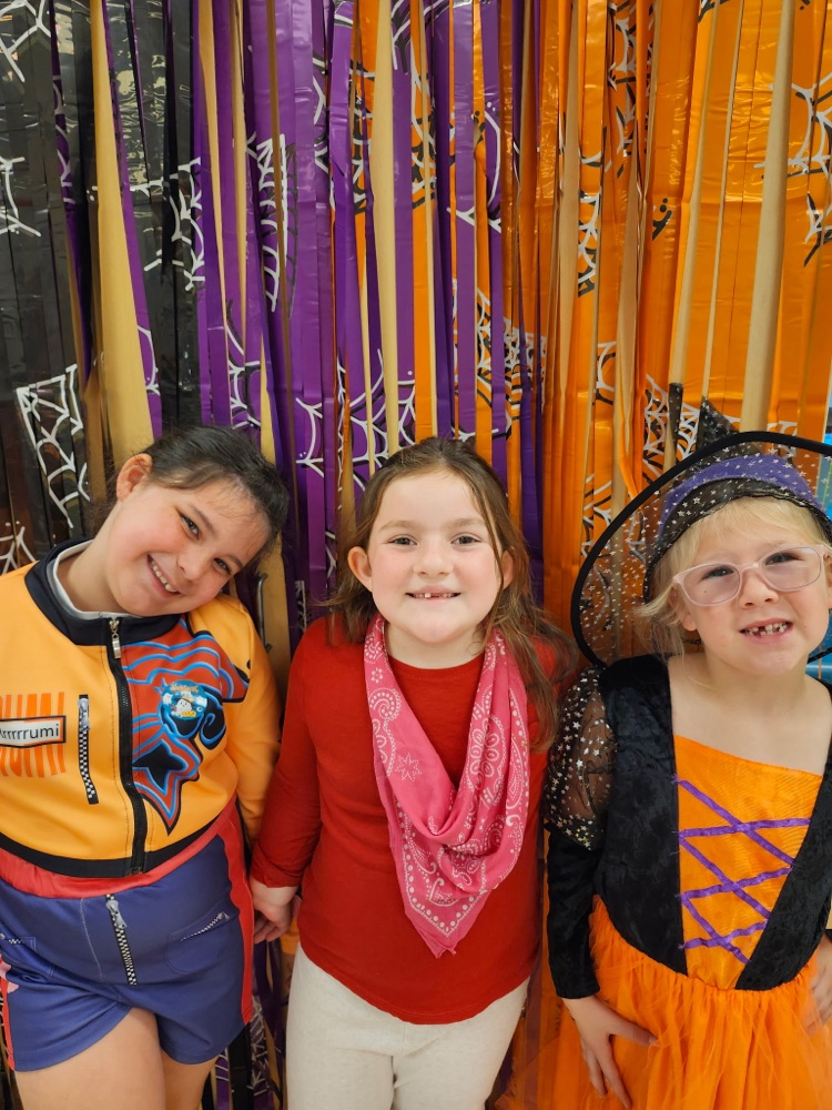 group of three students on Halloween 