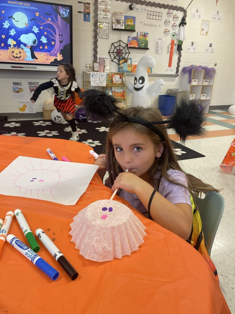 pumpkin and straw with student 