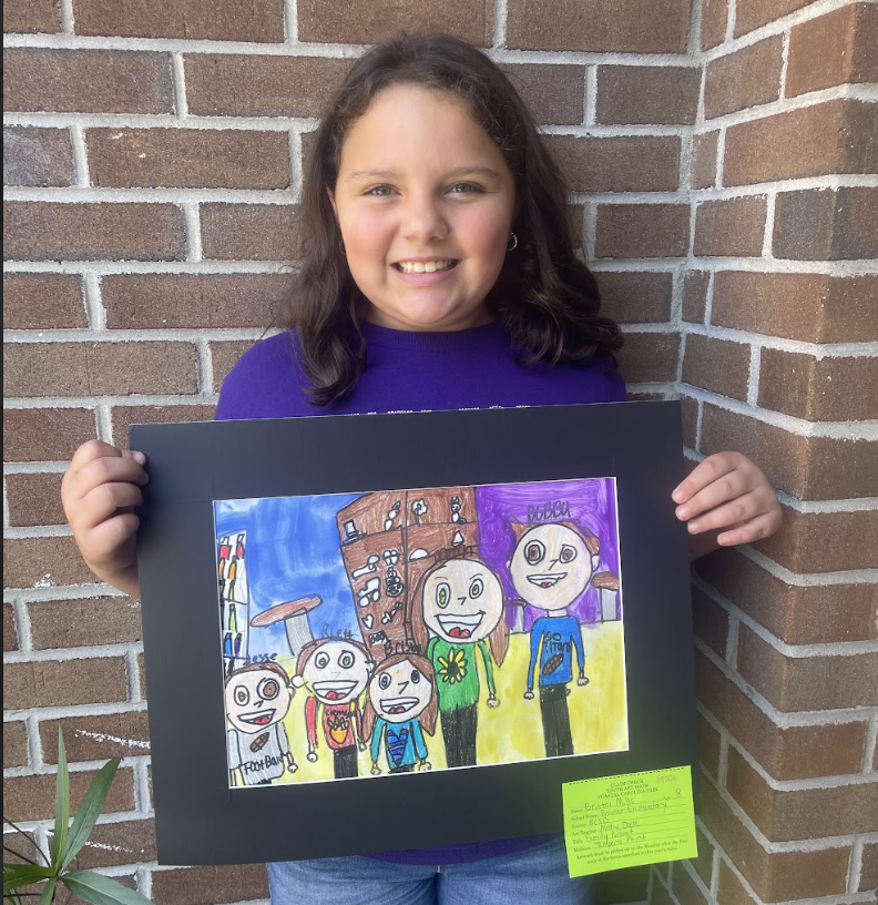 Student holding artwork (family portrait 2) 