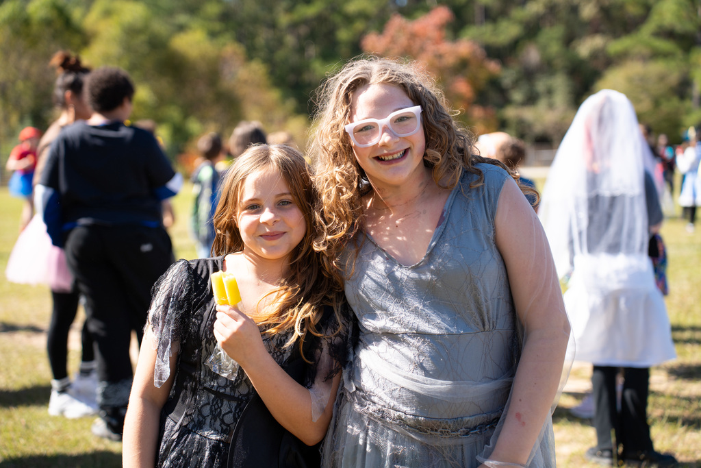 students posing with popsicles