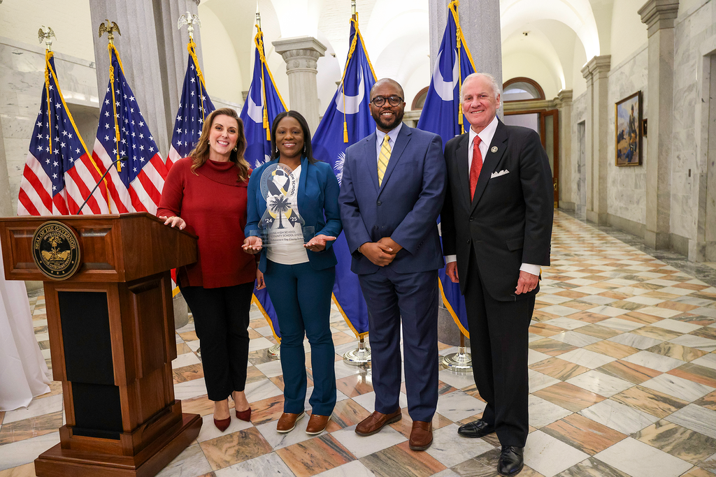 Cross High administration with Dr. Dixon and state officials