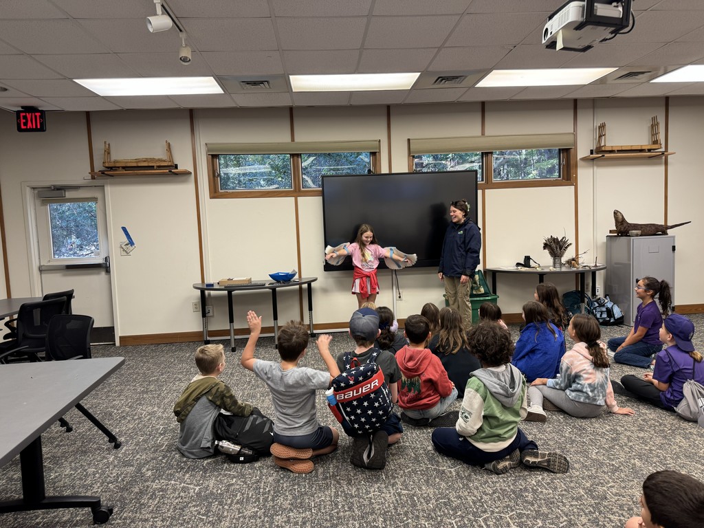 Students learn about the different features of a bird.