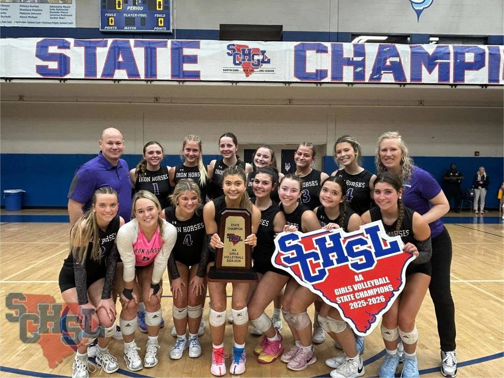 PSH volleyball team with state title trophy