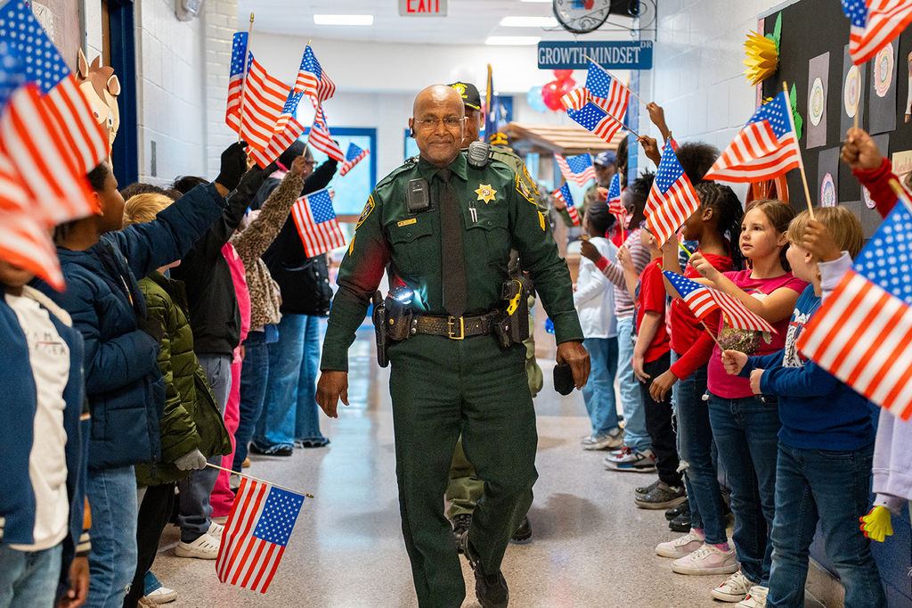 veterans being cheered down the hallway