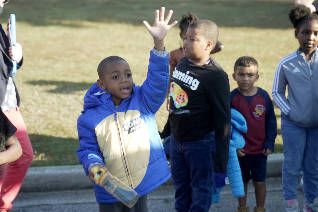 student raising hand