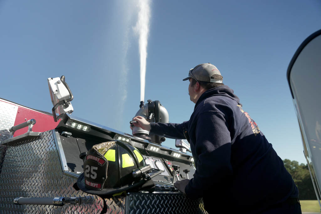 fireman blowing hose