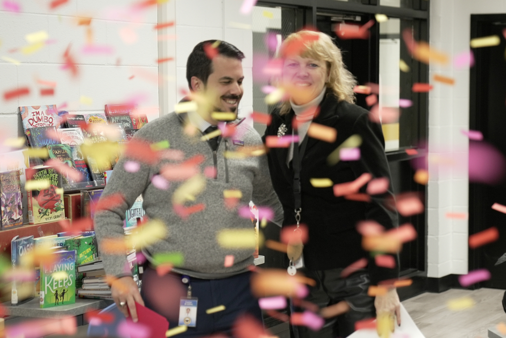 principal with confetti coming down