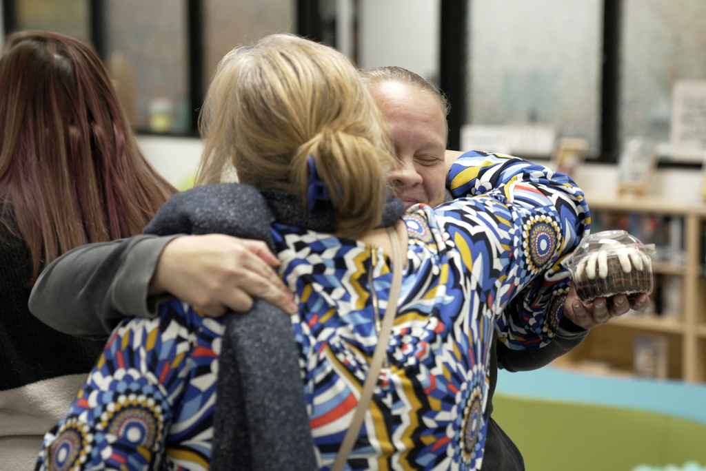 teachers hugging