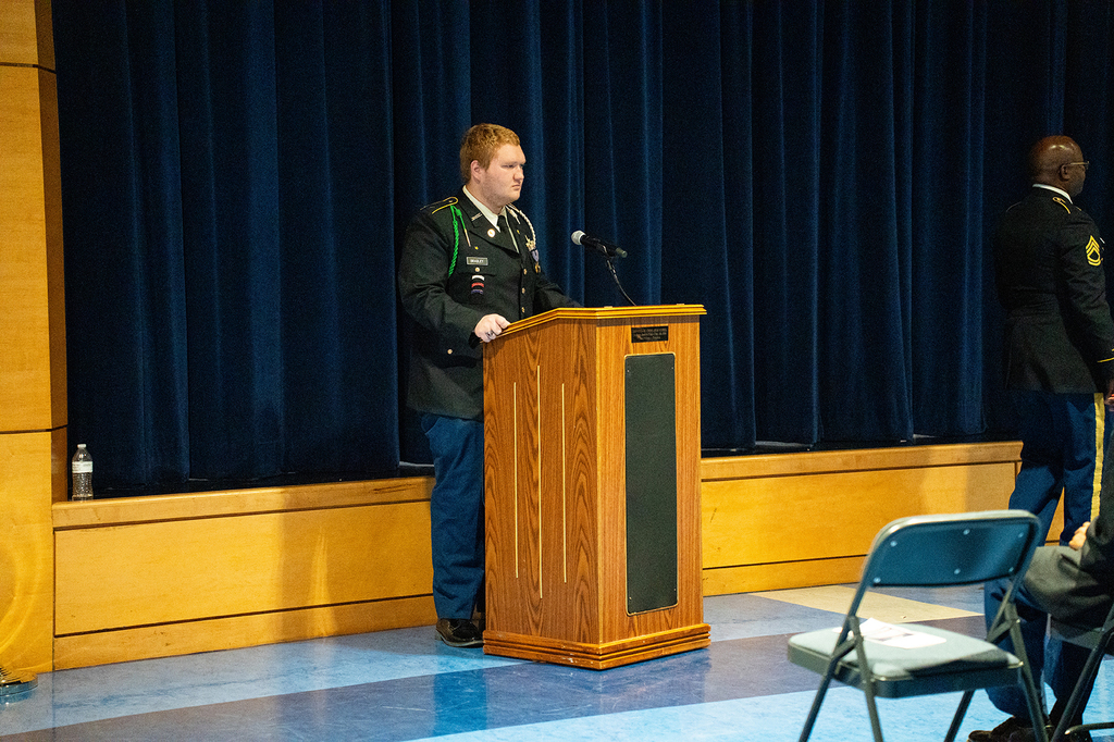student speaking at podium