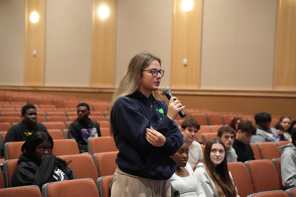 student speaking into mic