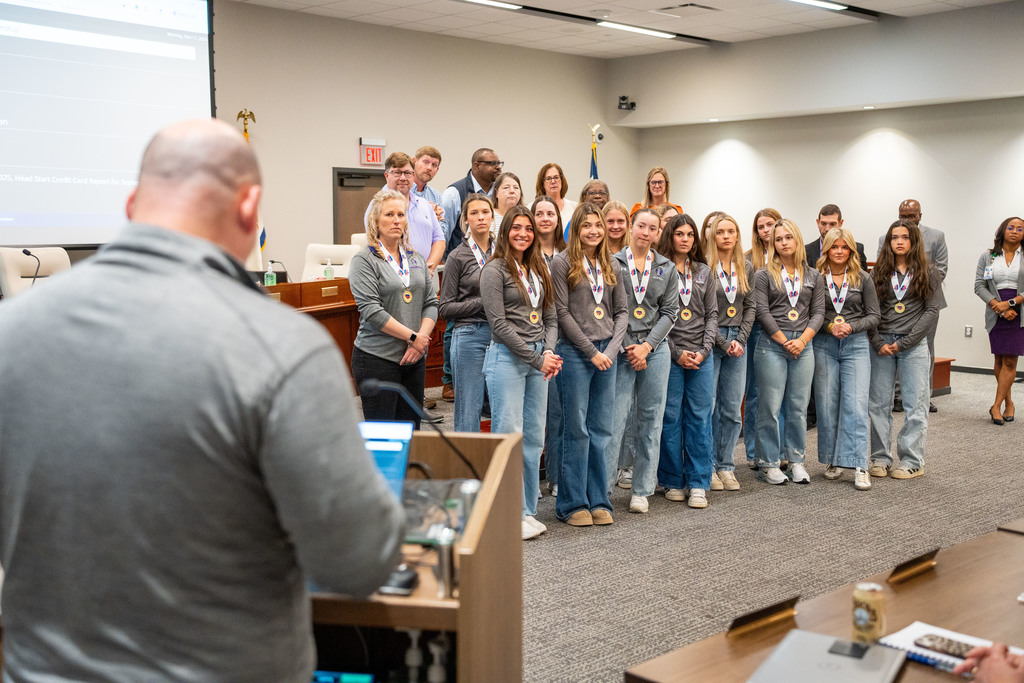 team watching coach speak