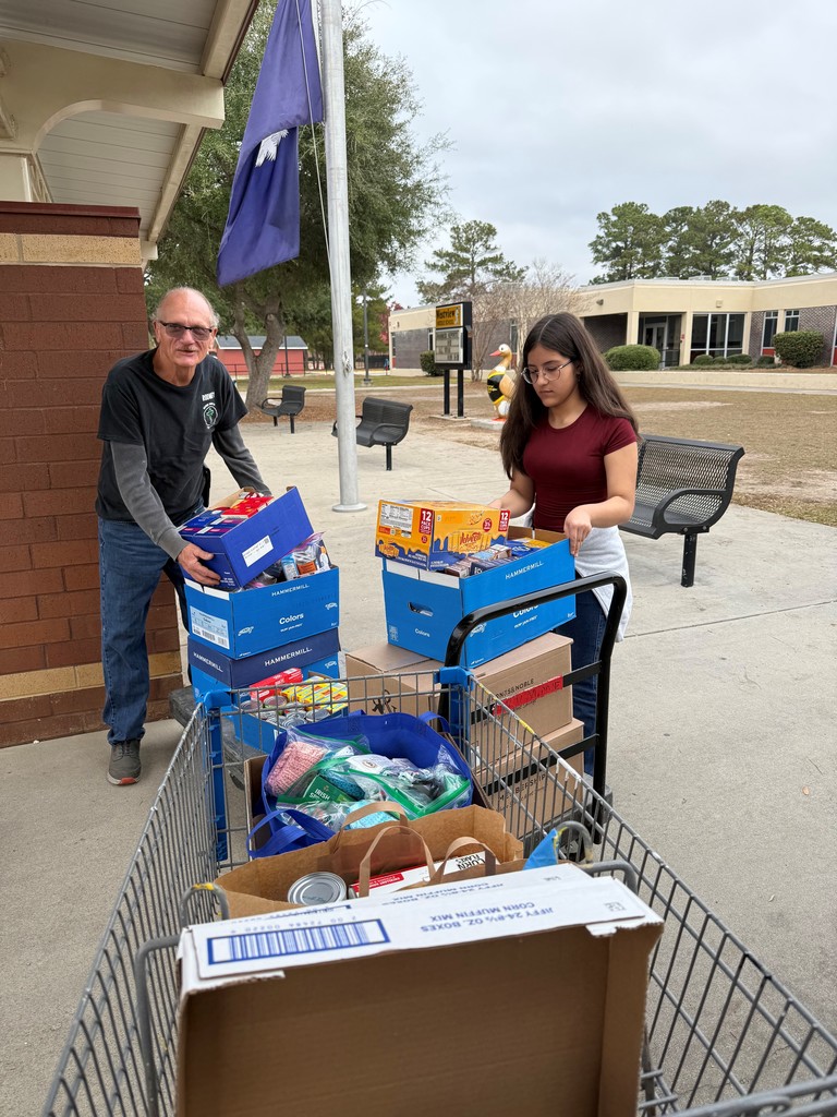 Food drive donations being collected by middle schoolers and donated to Helping Hands of Goose Creek.