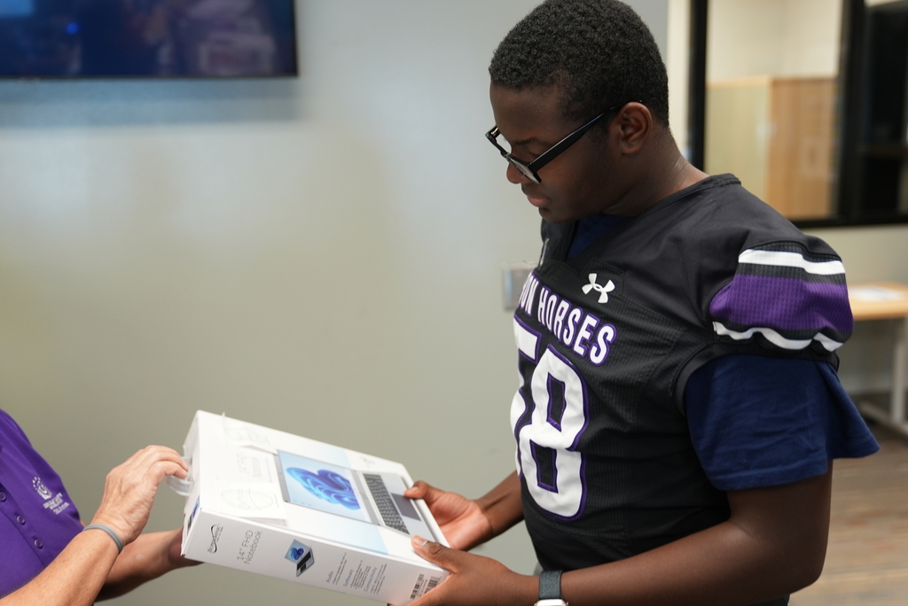 PSH student being gifted laptop