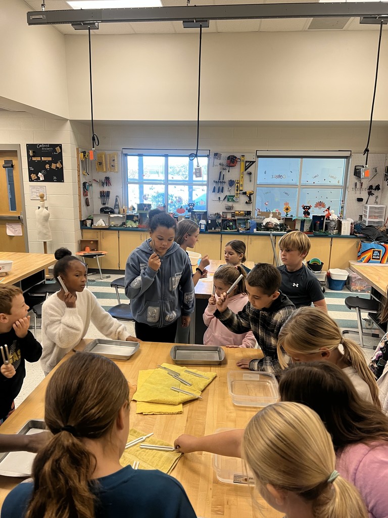 The students work together to create waves.