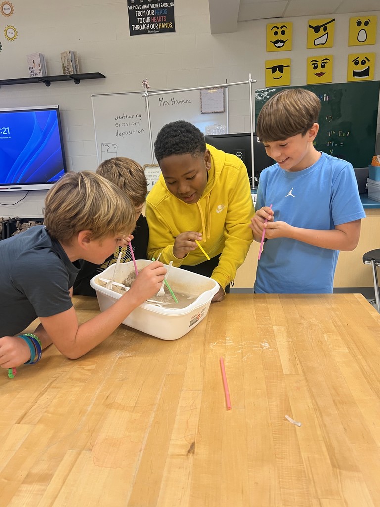 Students examined erosion and deposition with their models.