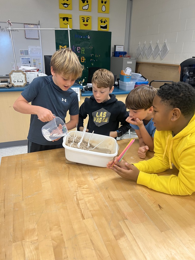 The students used water to watch deposition on their model.