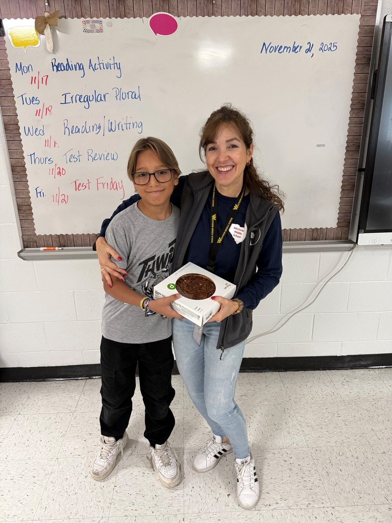 Student and teacher pose with winning pie