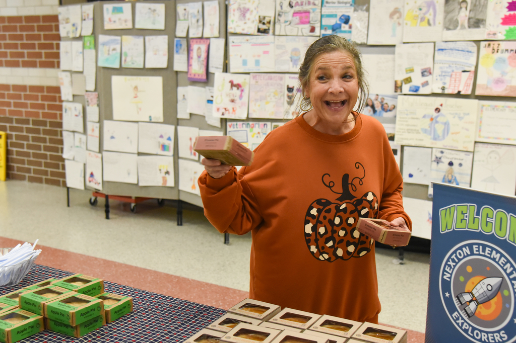 staff member picking up pie