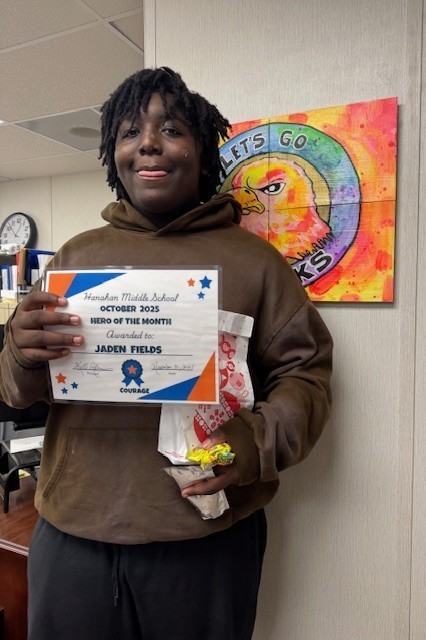 8th grade Student of the month Jaden Fields with certificate