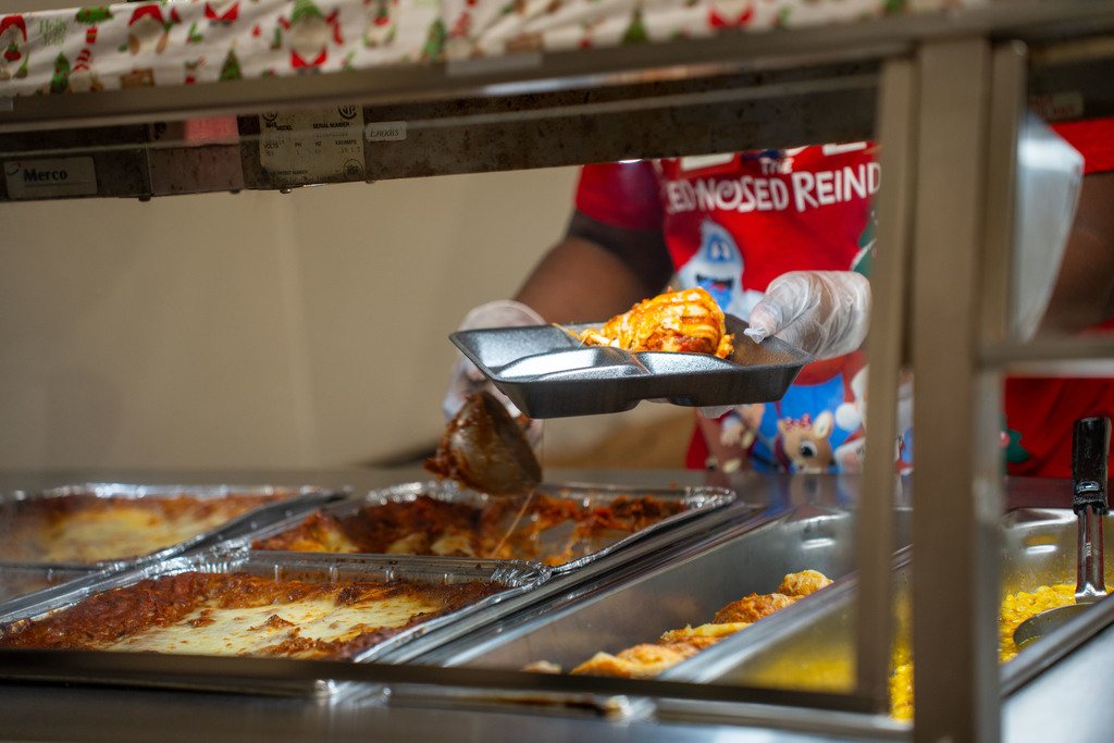 CNS worker making tray