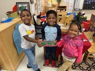 3 students with craft