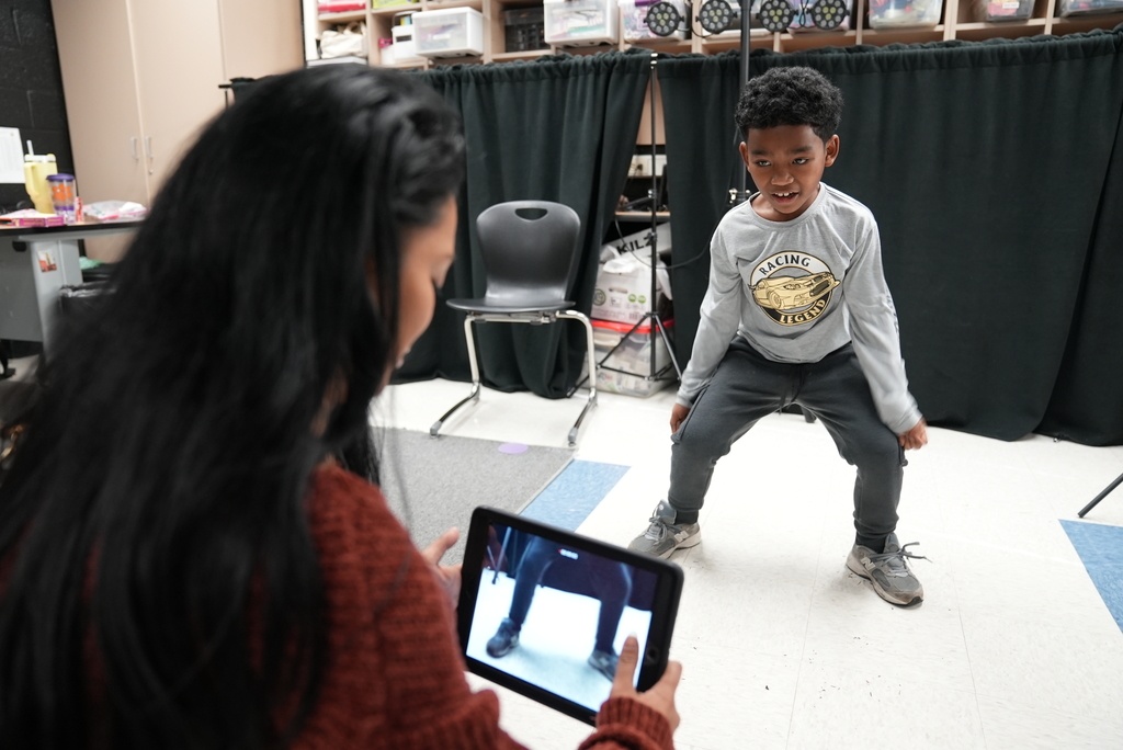 parent filming student for movie making class
