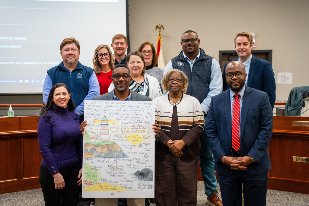 principal with poster and board members