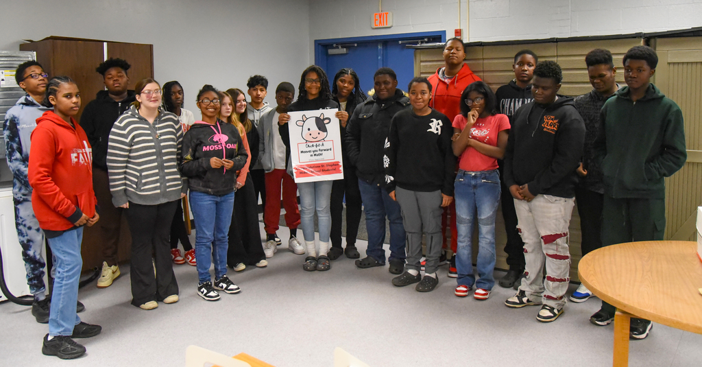 group photo with sign
