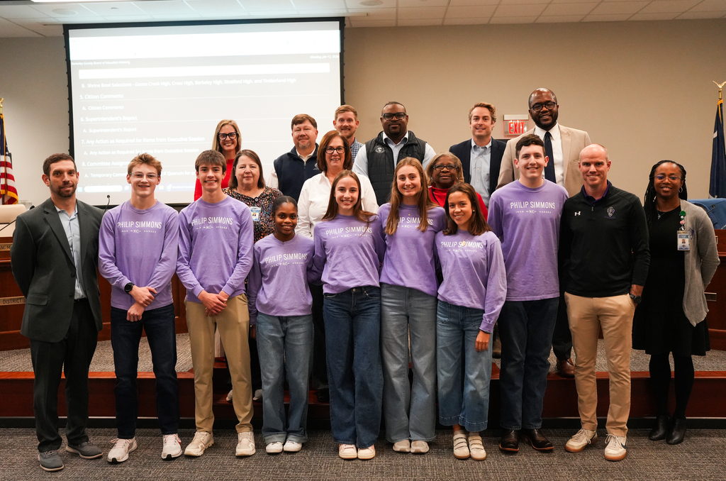 PSH cross country team with board members