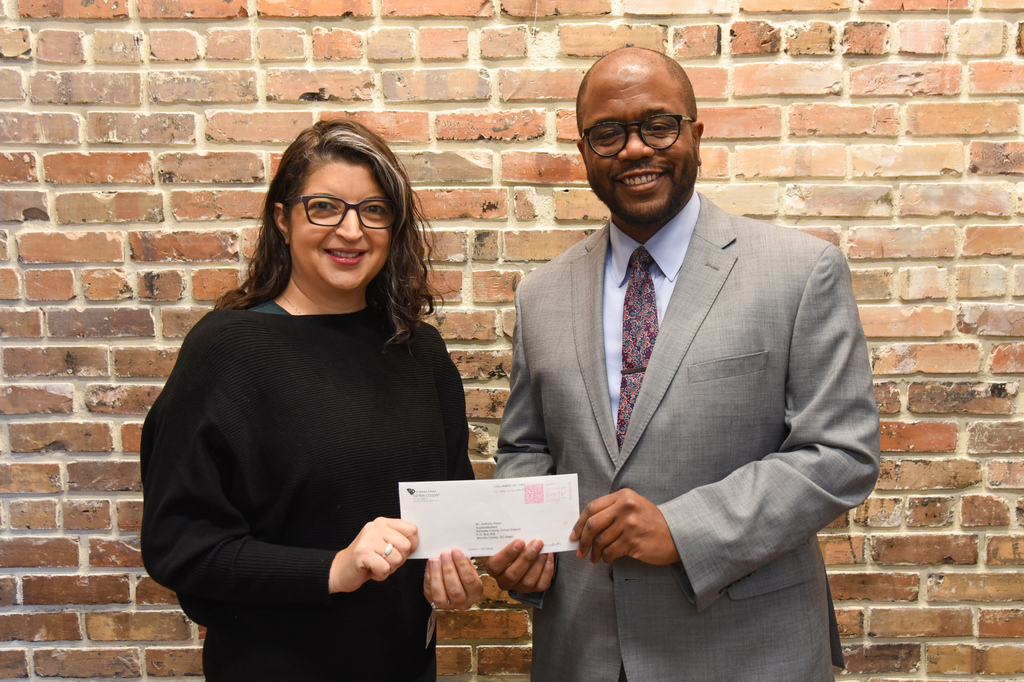 Dr. Dixon and Brandy Incorvia with Santee Cooper check