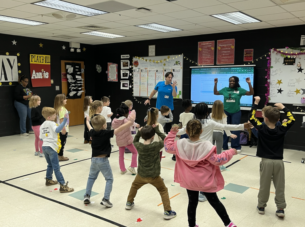 Students in the drama room participating in a residency with the Charleston Stage! Students are dancing! 