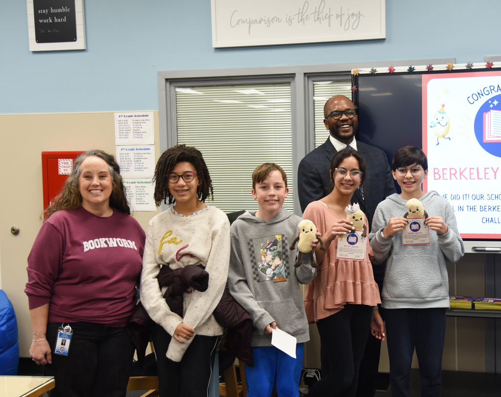 MMSOA students and staff with district leadership receiving Berkeley Book Blast Star School trophy