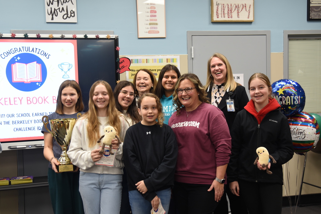 MMSOA students and staff with district leadership receiving Berkeley Book Blast Star School trophy