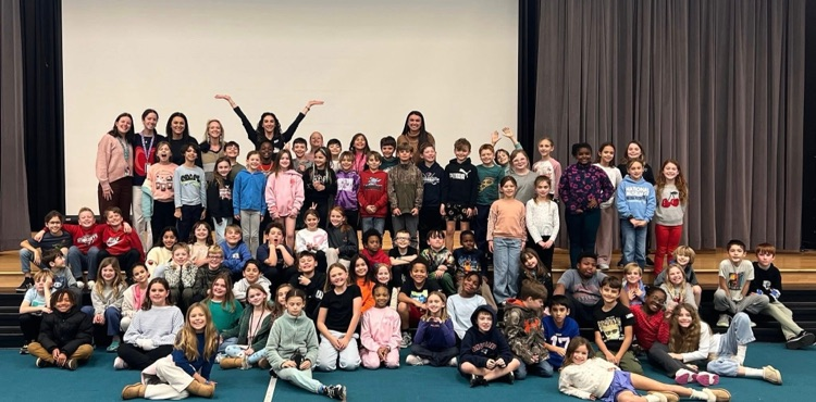 Group picture of third graders and meteorologist  