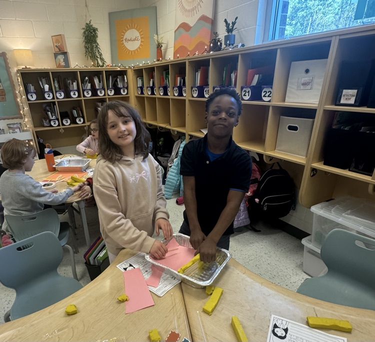 students building a model house 