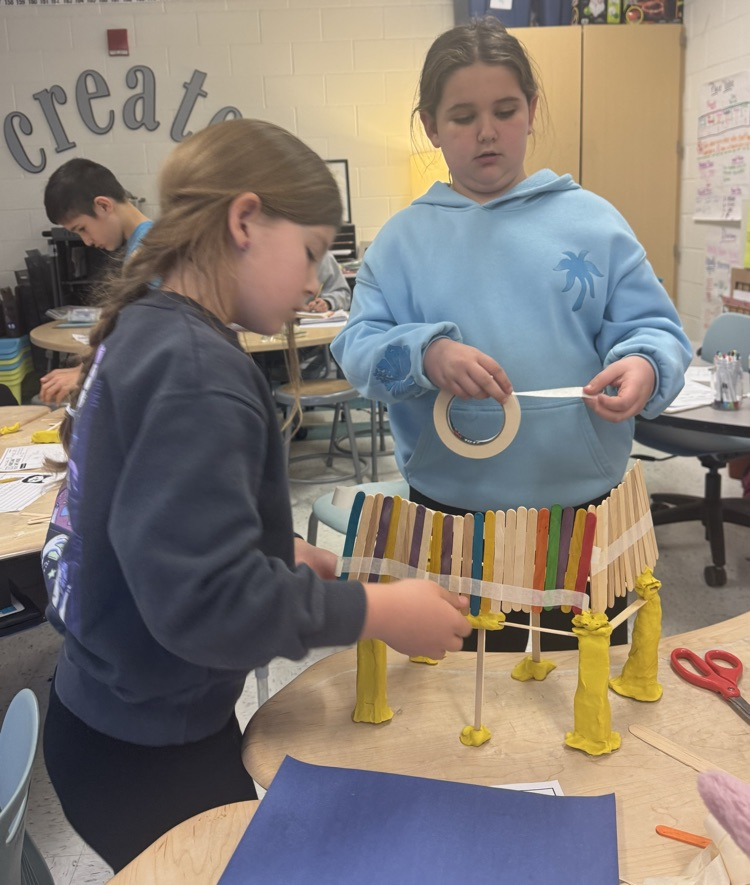students building a model house 