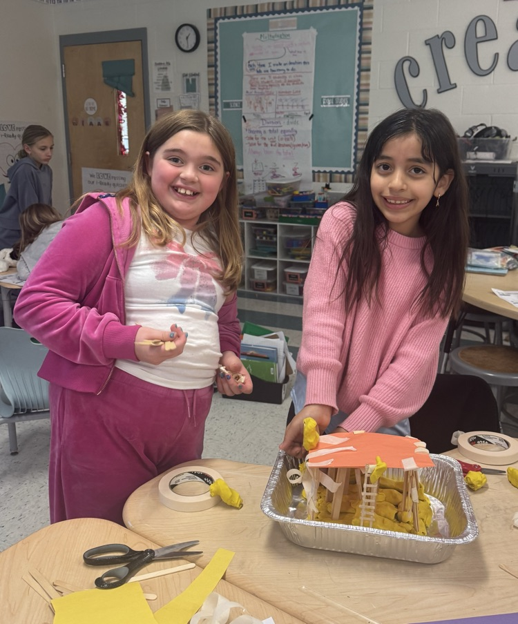 students building a model house 