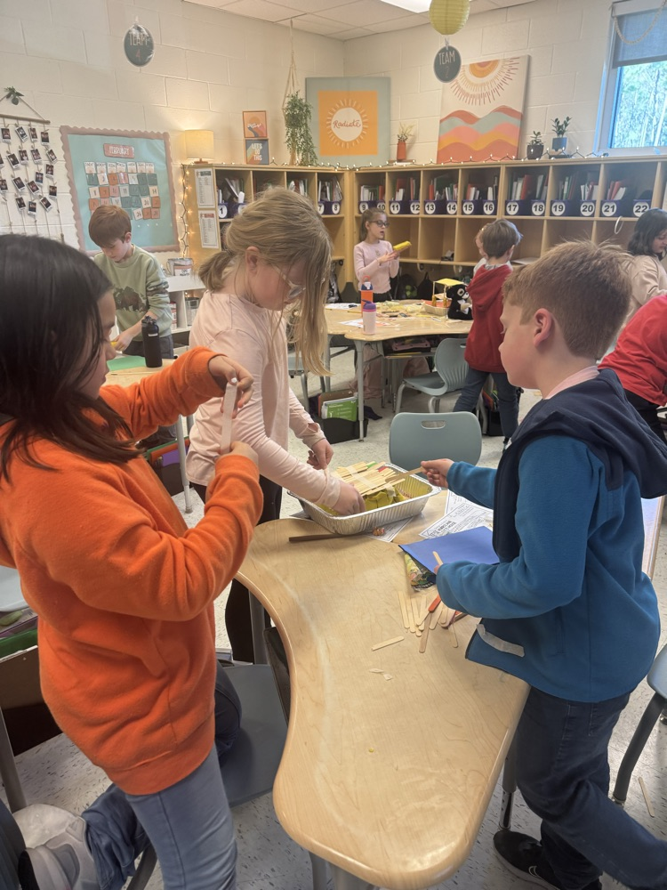 students building a model house 